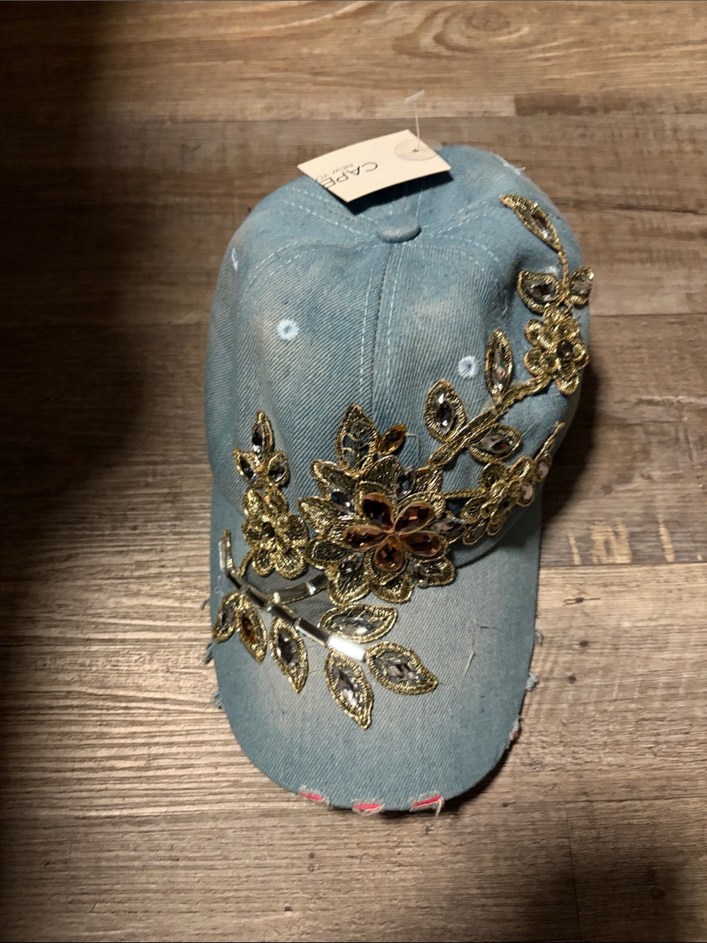 Capelli of New York Light Blue Denim Cap with Gold Floral Appliqué
